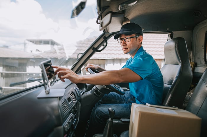 A delivery driver in a van.