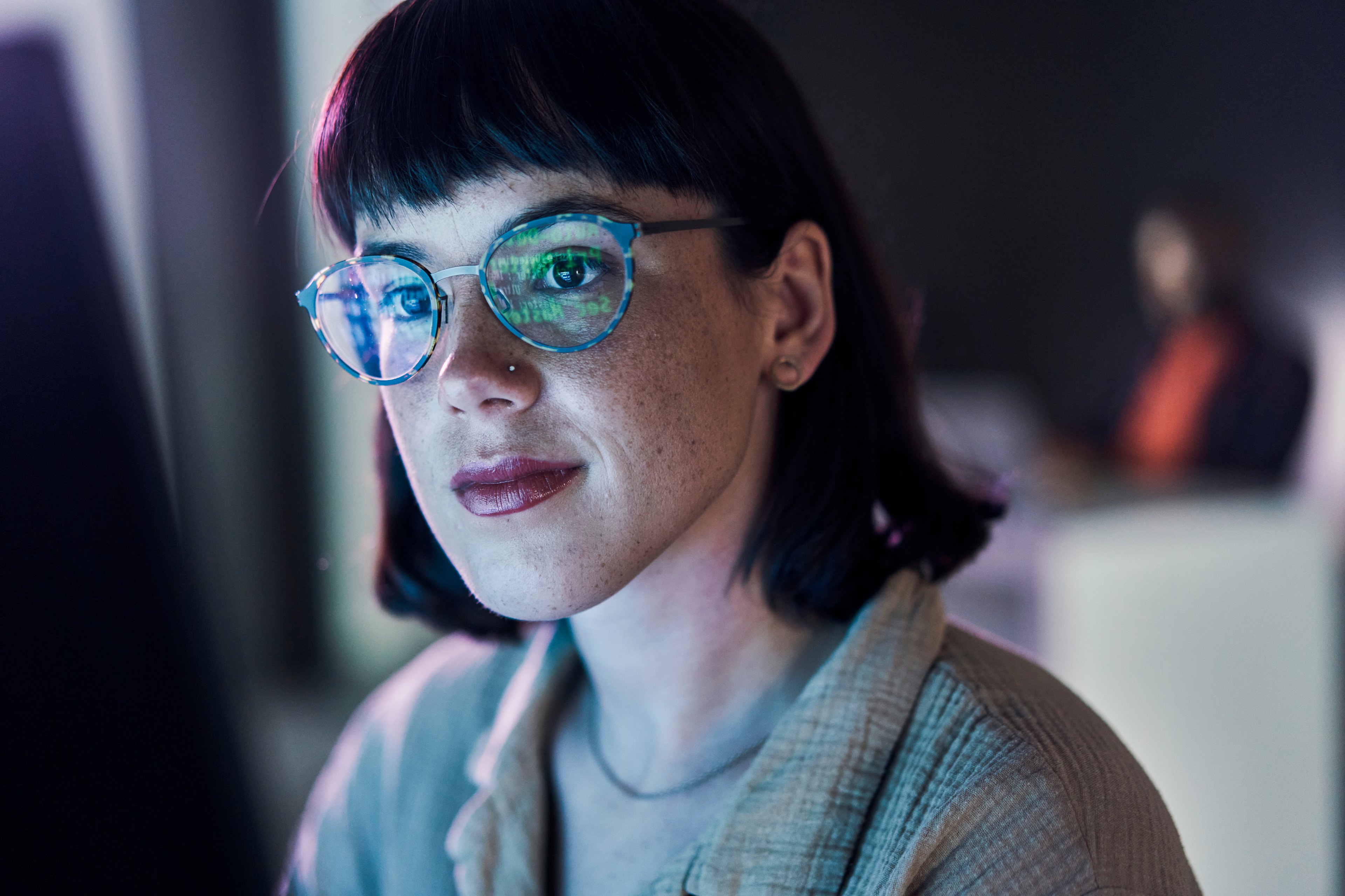 Computer user with numbers reflected in glasses 1469706451