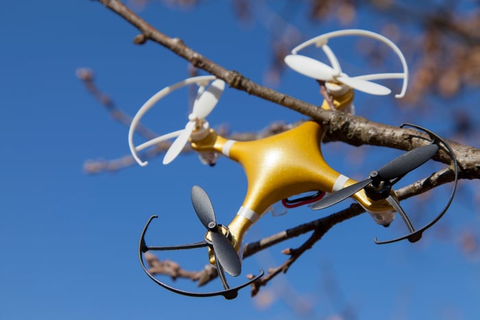 Quadcopter drone stuck in a tree.