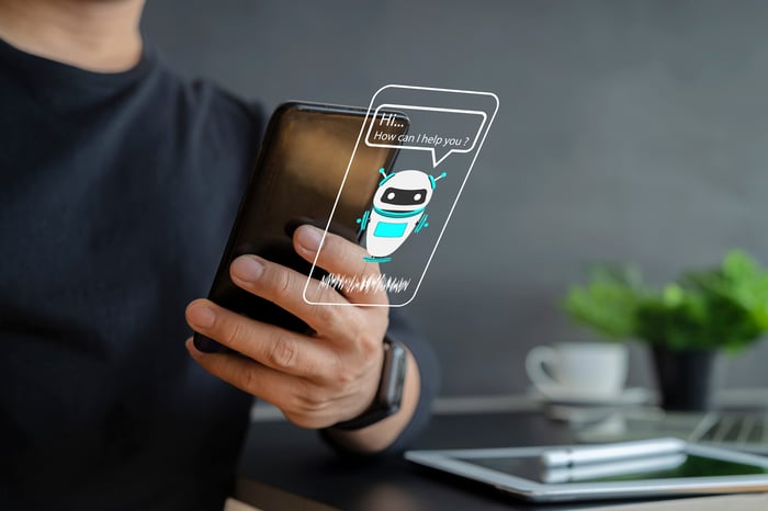 A mobile phone user engages with an AI chatbot.