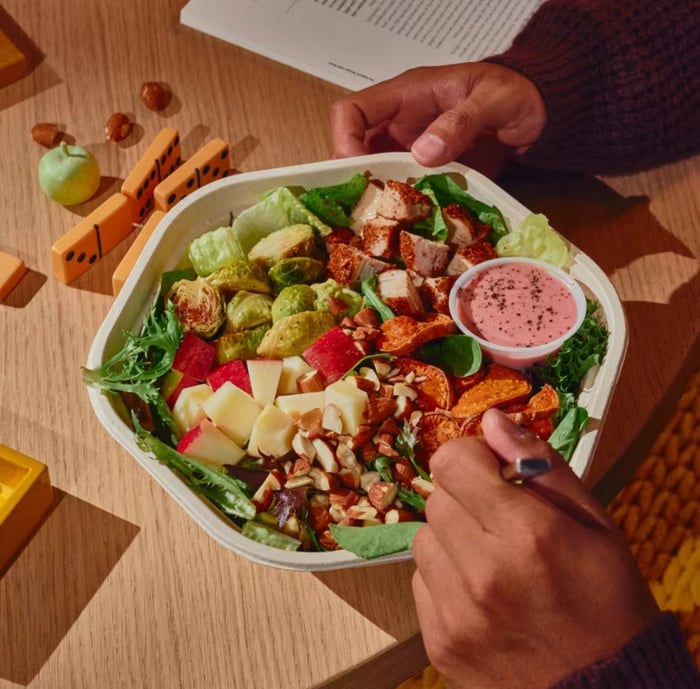 A Sweetgreen salad on a table.