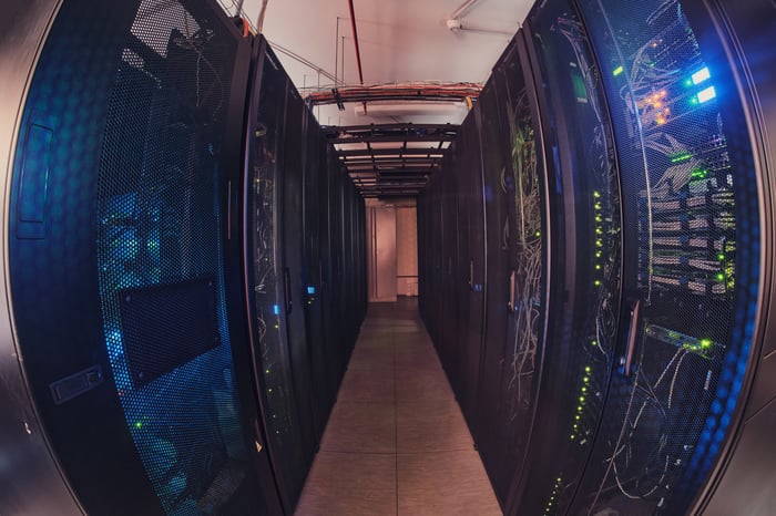Rows of servers in a data center viewed through a fish eye lens.