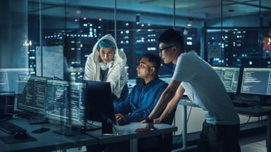 Professionals_working_on_computers_at_night_in_an_office