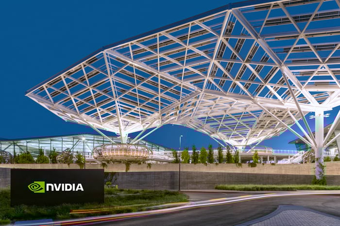 Nvidia's Santa Clara headquarters at dusk with the Nvidia logo sign in the front.