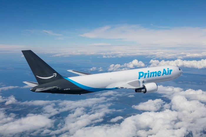 An Amazon Prime Air jet flying above clouds.
