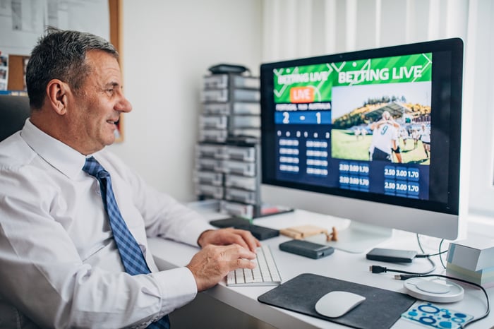 A person placing live bets on sports from their computer.