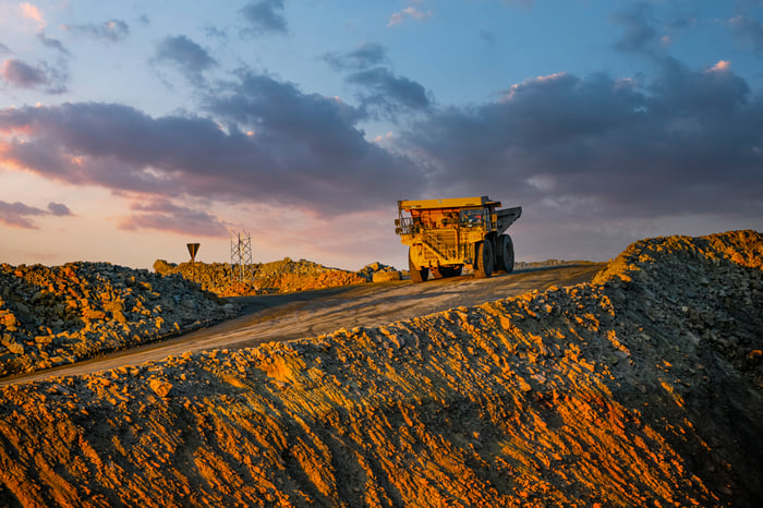 A mining truck operating at dawn