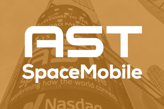 AST SpaceMobile logo set over copper-colored background from its Nasdaq IPO.