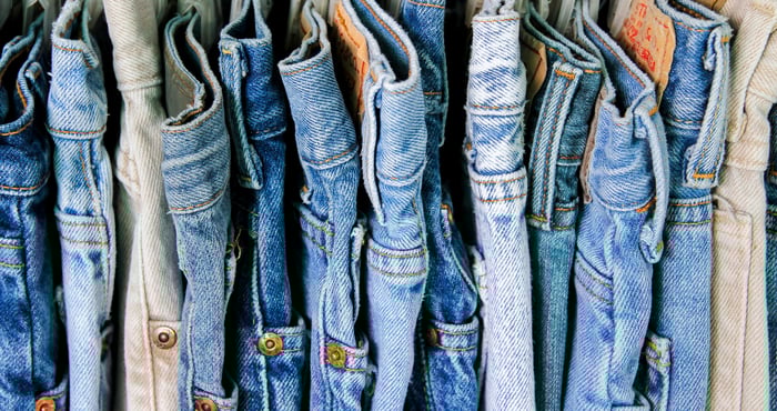 A rack of blue jeans.