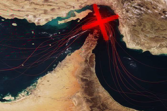 A red X on an illustrated map of the Strait of Hormuz. 
