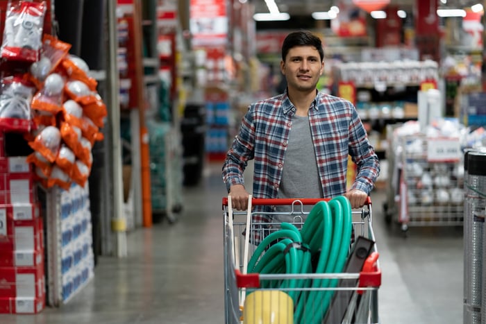 A Costco shopper loads up a cart.