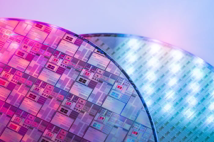 A picture of two silicon wafers.