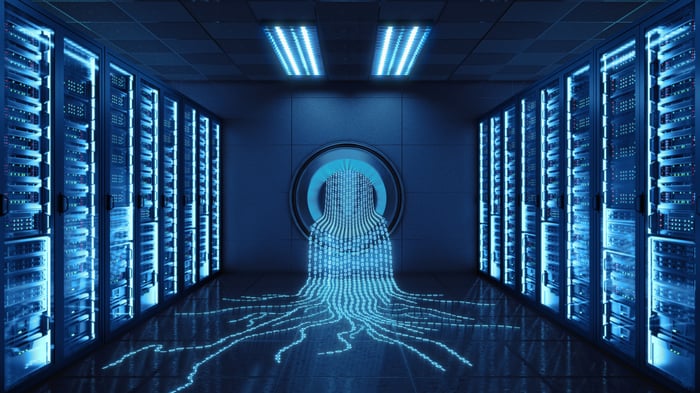 Lines of code spill out of a vault. 