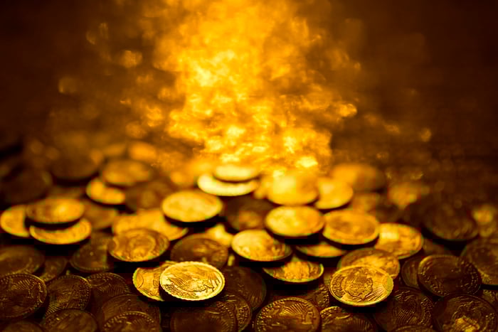 Pile of illuminated gold coins. 