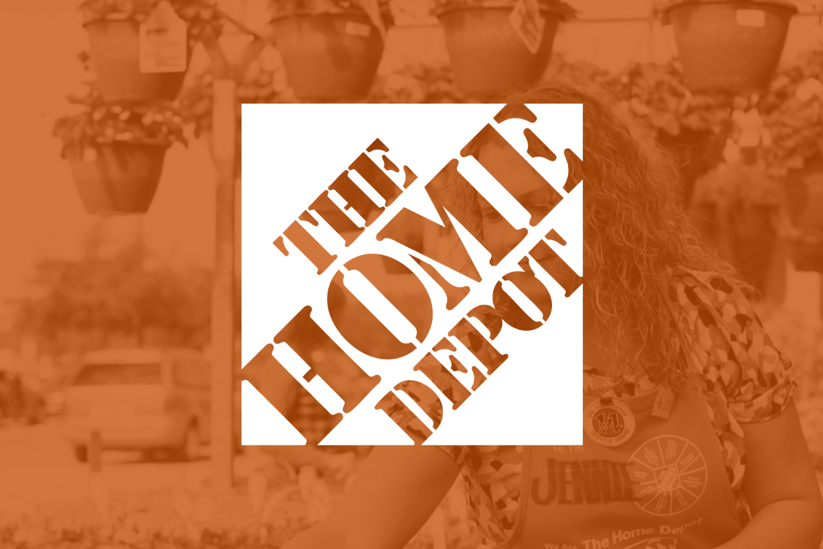 Home Depot logo on orange filter with employee in background_ The Motley Fool