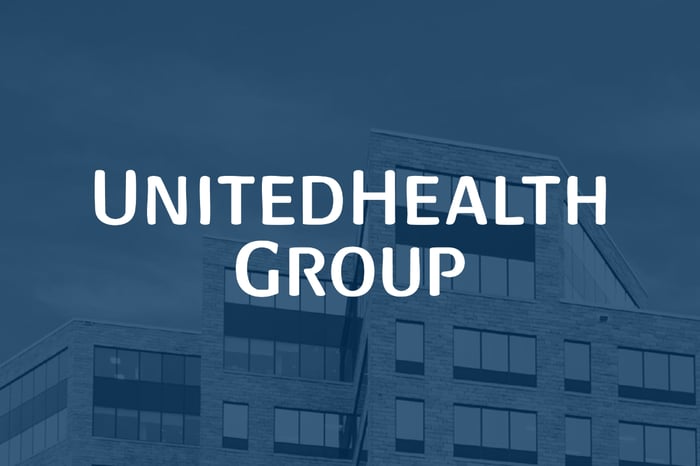 UnitedHealth Group logo overlaid on a shadowy blue background.