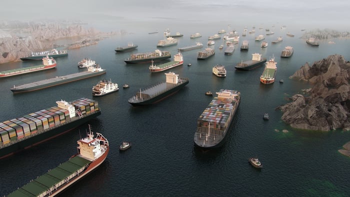 Several ships sitting at a port.