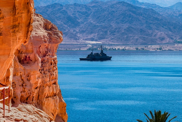 A navy ship in the water.