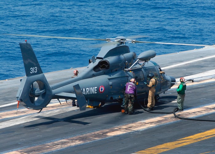 A defense helicopter on an aircraft carrier. 