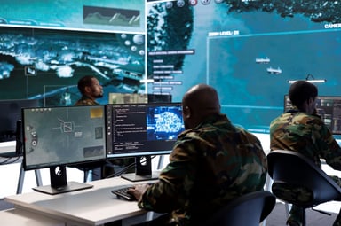 A group of people working on computers and analyzing data.