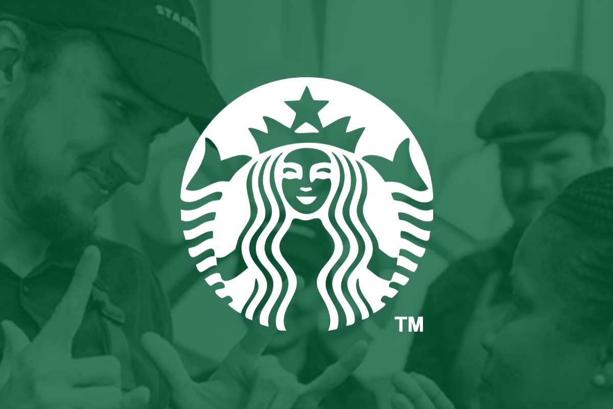The Starbucks logo superimposed over an image of a barista interacting with a customer