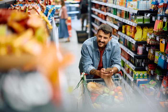 A person shopping at a grocery store.