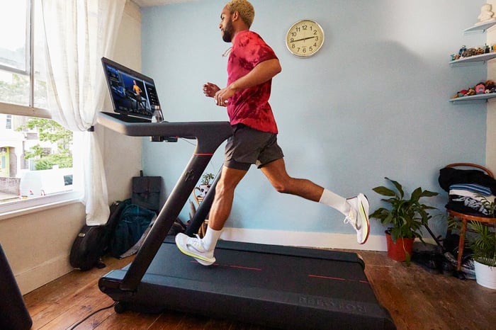 Person running on a Peloton Tread.
