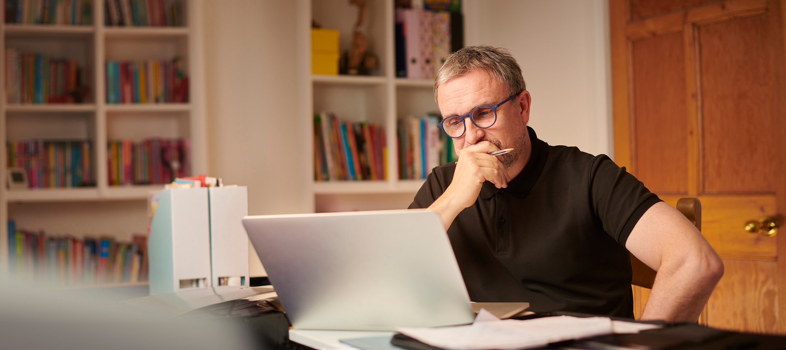 Man middle aged laptop_GettyImages-1206456853