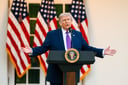 White House President Trump outdoors podium arms out