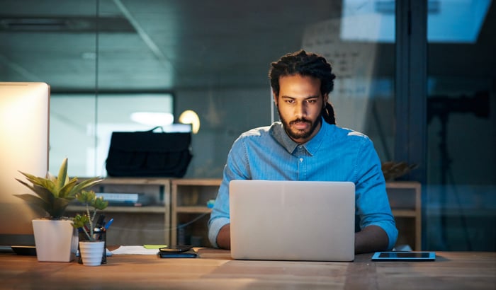 Investor looking at a laptop. 