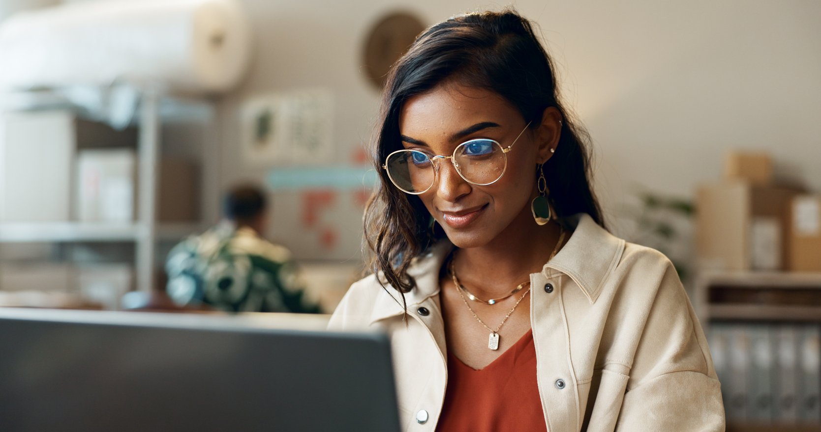 Young person looking at laptop