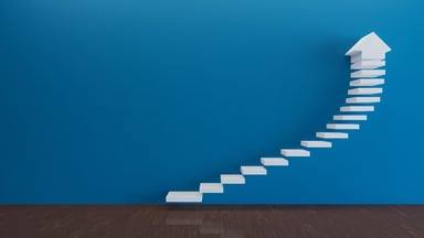 Architecture showing tiles forming a gradual upward sloping pattern before turning into exponential growth topped by an arrow.