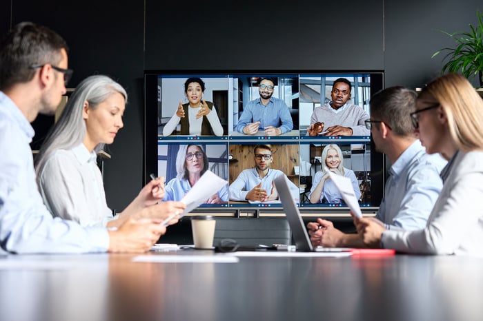 People are in a video conference. 