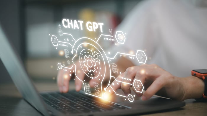 A person using ChatGPT on their laptop.