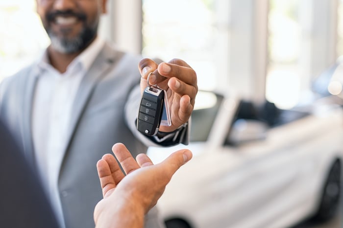 Handing over car keys. 