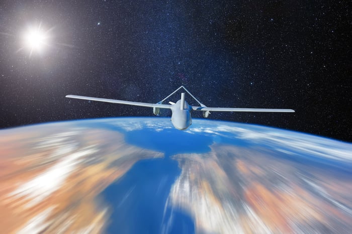 A drone in space flying over the earth.
