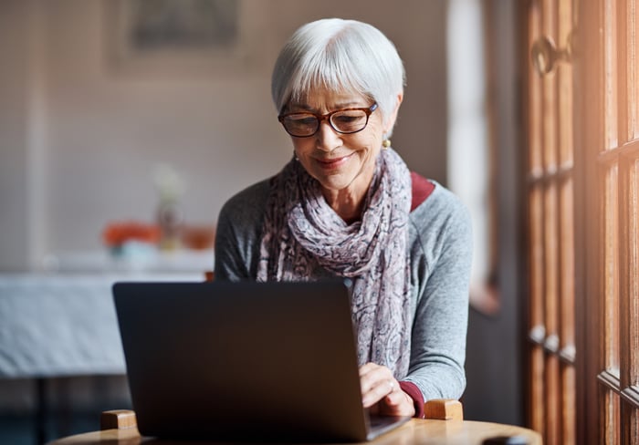 A person at a laptop.