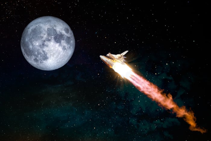 A rocket ship going to the moon.