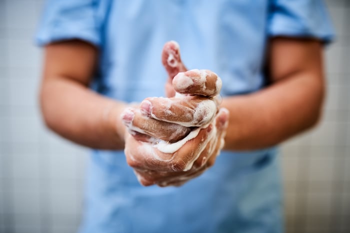 An individual washes their hands. 