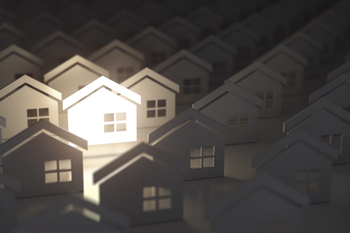 Cardboard cutouts of houses.