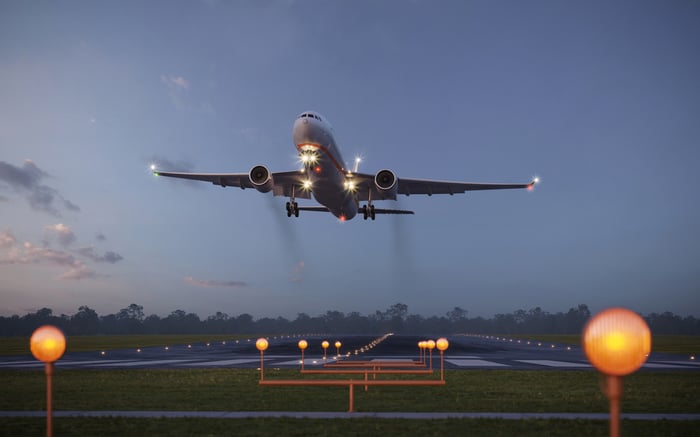 An airplane takes off from a runway.