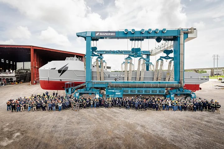 Saronic's workforce next to the Marauder drone boat they built in under a year. IS Saronic