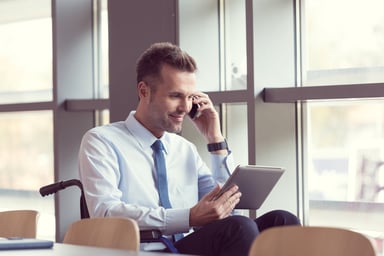 GettyImages-investor uses tablet and phone