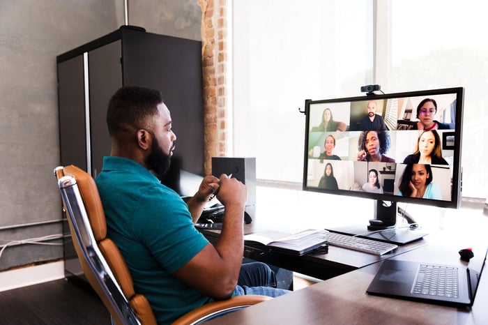 A person has a video conference in an office.
