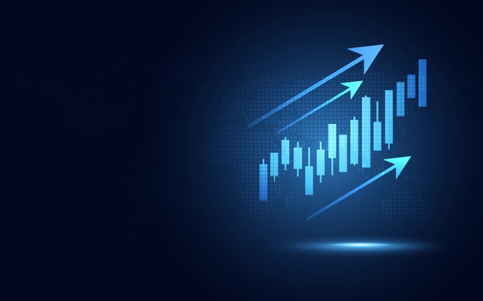 Futuristic blue glowing rising arrow chart.
