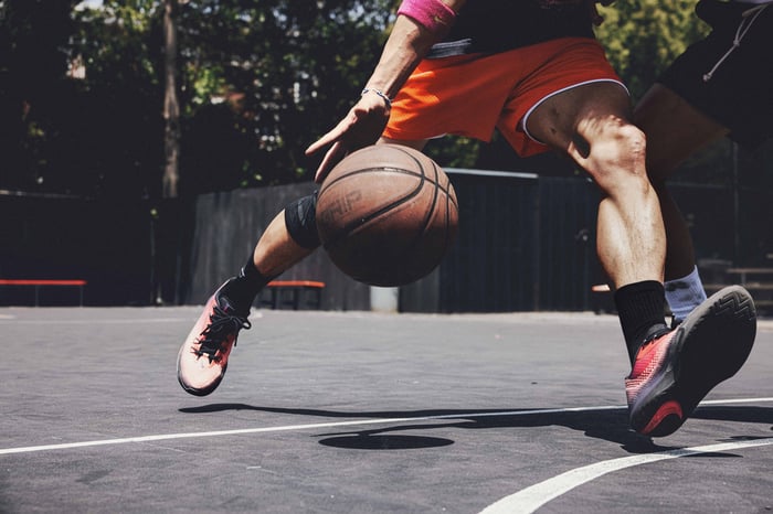 Playing basketball in Nike shoes.