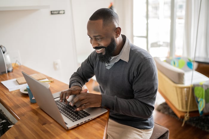 A person at a laptop.