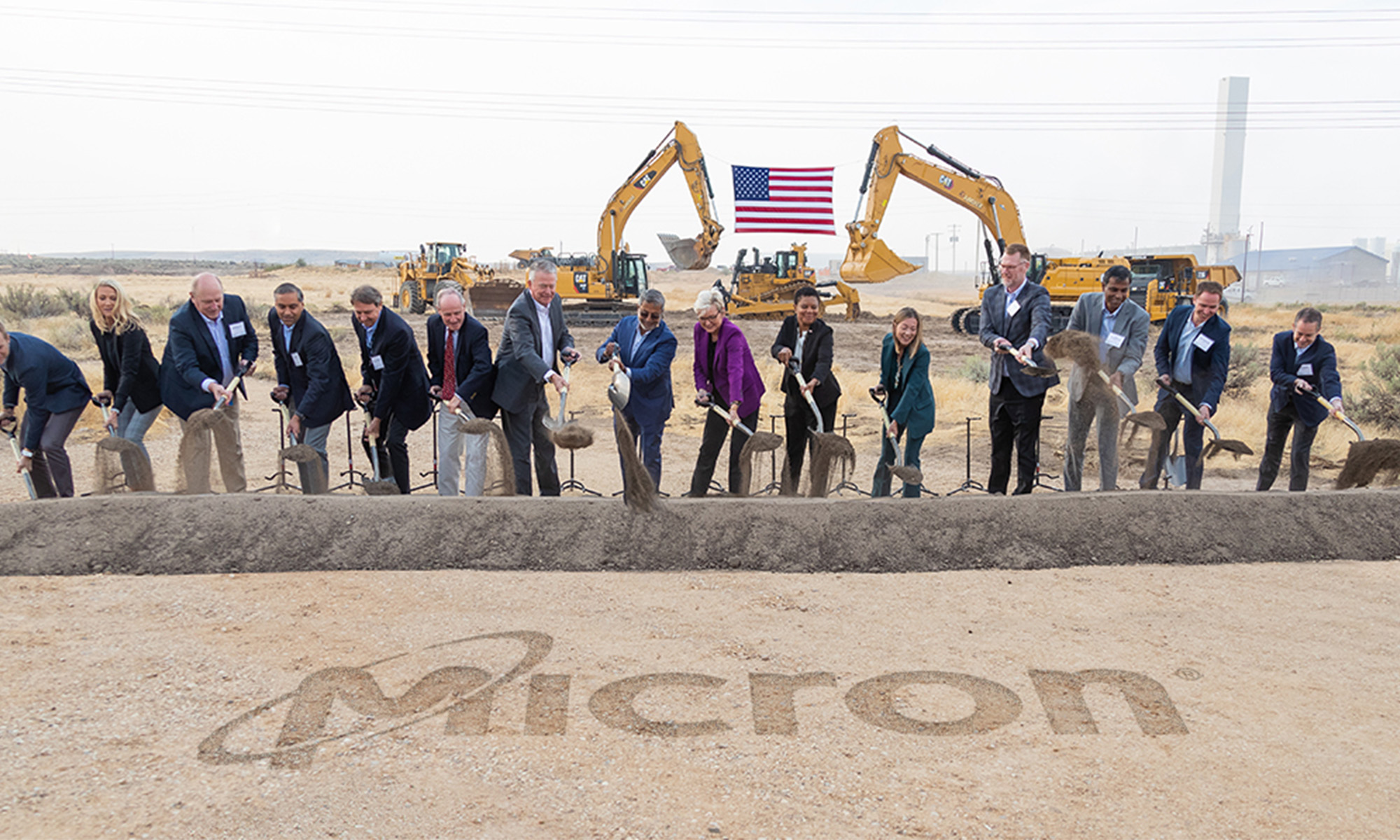 micron technologies team breaking ground with micron logo in dirt_micron