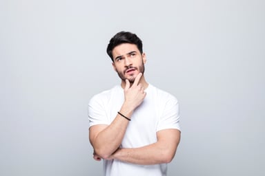 Person in a White Shirt Wondering About a Question