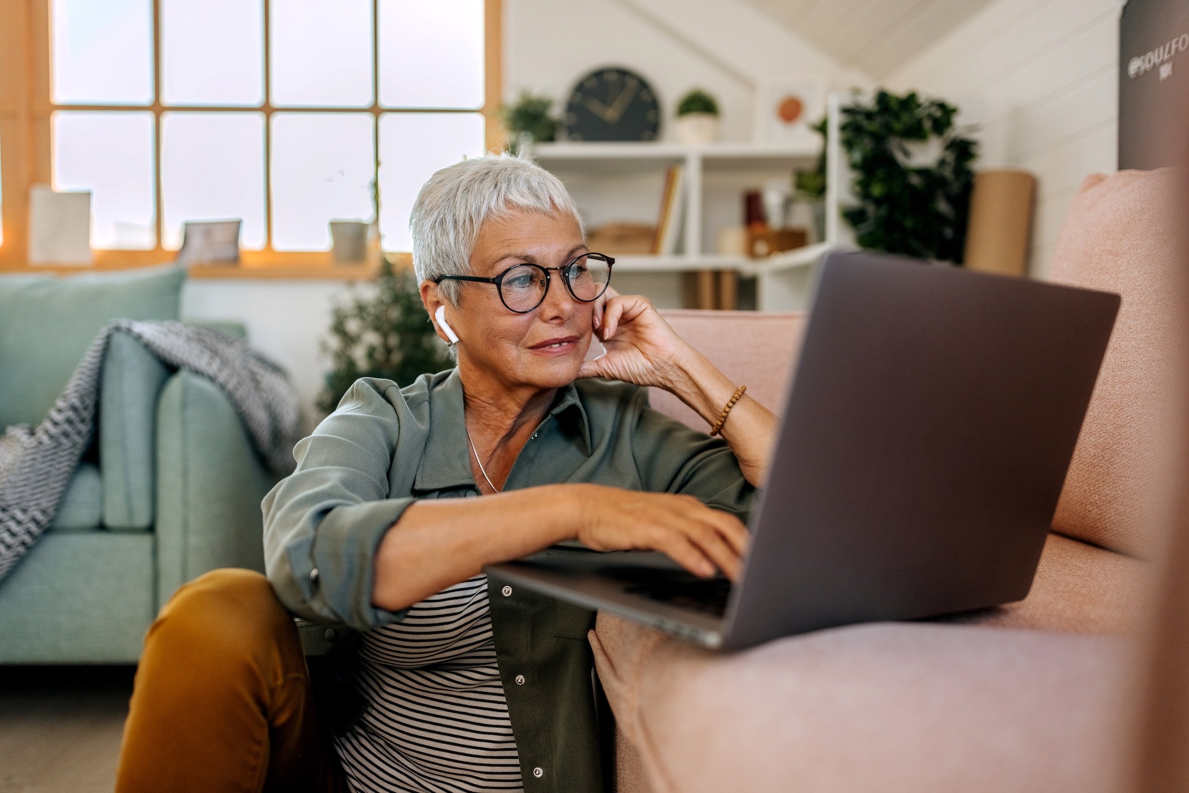 Woman types on laptop